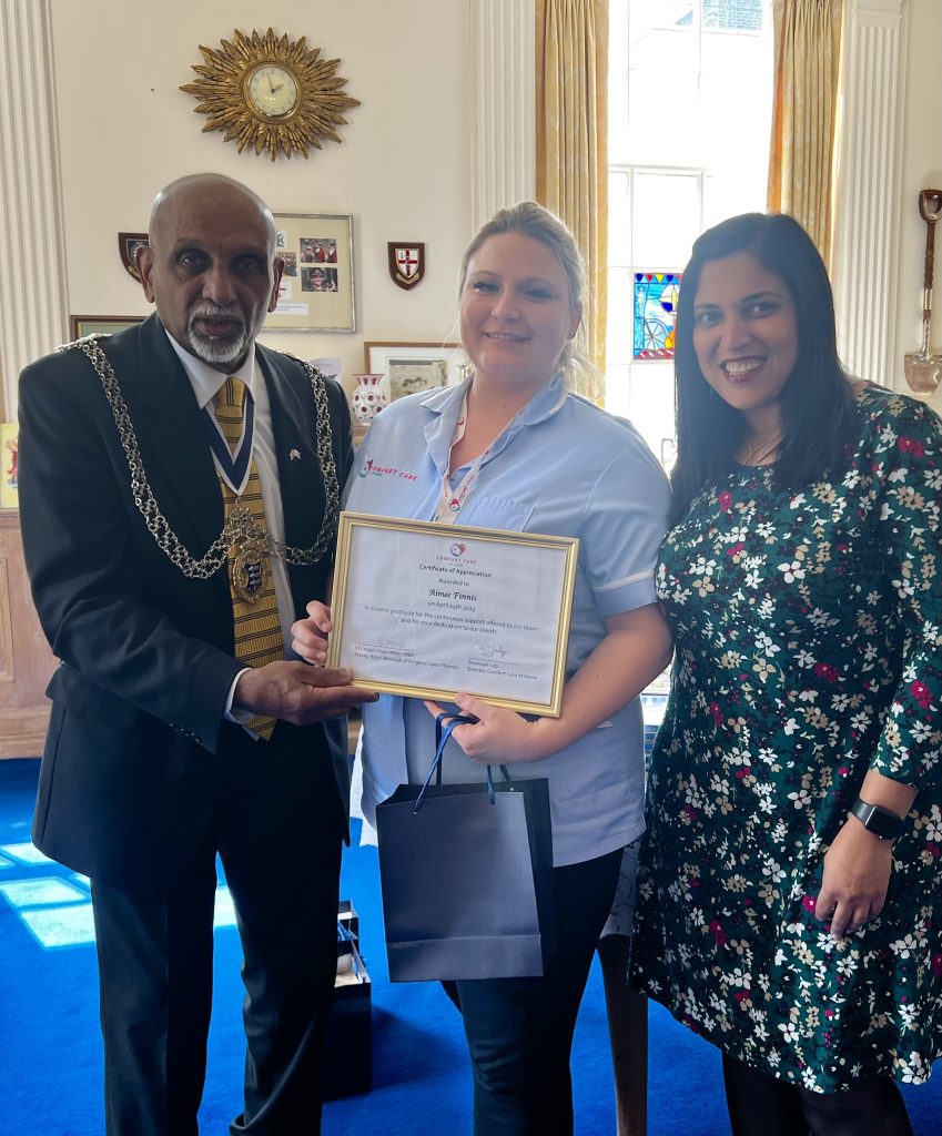 Comfort Care At Home team receiving an award from Mayor of the Royal Borough of Kingston Upon Thames, Cllr Yogan Yoganathan